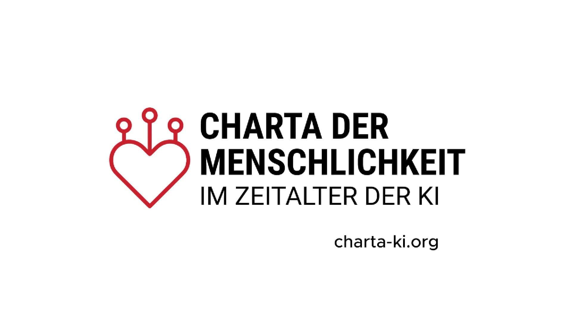 Alt: Logo der Charta der Menschlichkeit im Zeitalter der KI mit rotem Herz und schwarzen Texten.